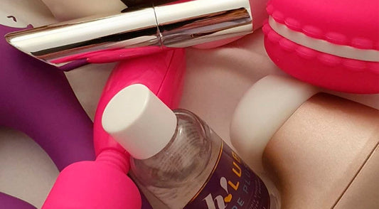 assortments of different sex toys with bottle of lube