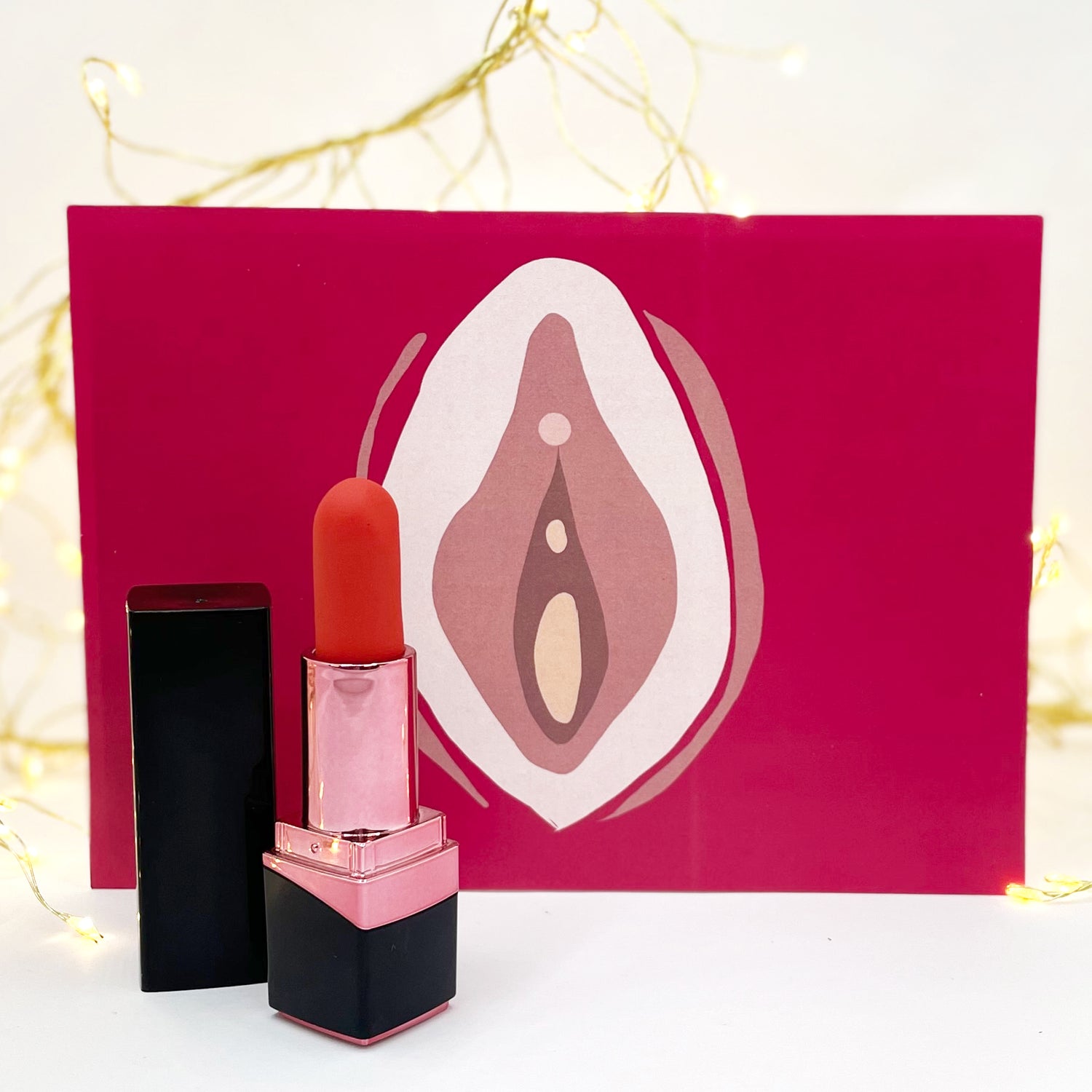 Clitoris and vulva illustration with clitoral lipstick vibrator - Sh! Women's Store