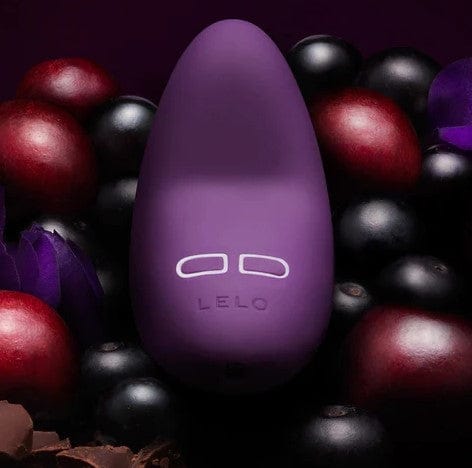 Lelo Lily Dark Plum Designer Vibrator, nestling in berries.