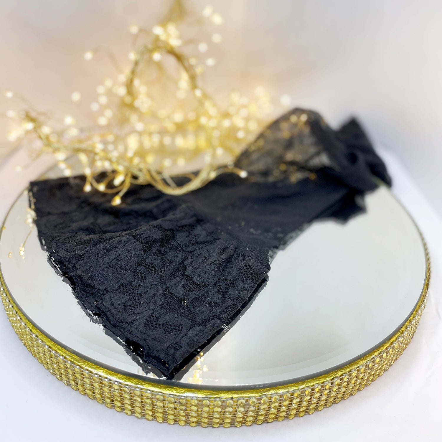 black stocking on a mirror platter